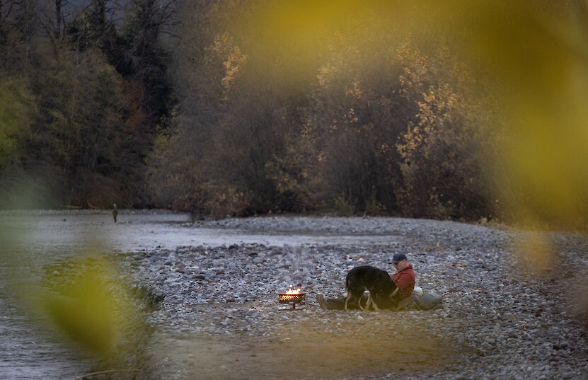 A fisherman and his dog on the Squamish River